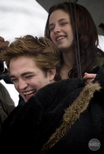 A giggling Edward and Bella